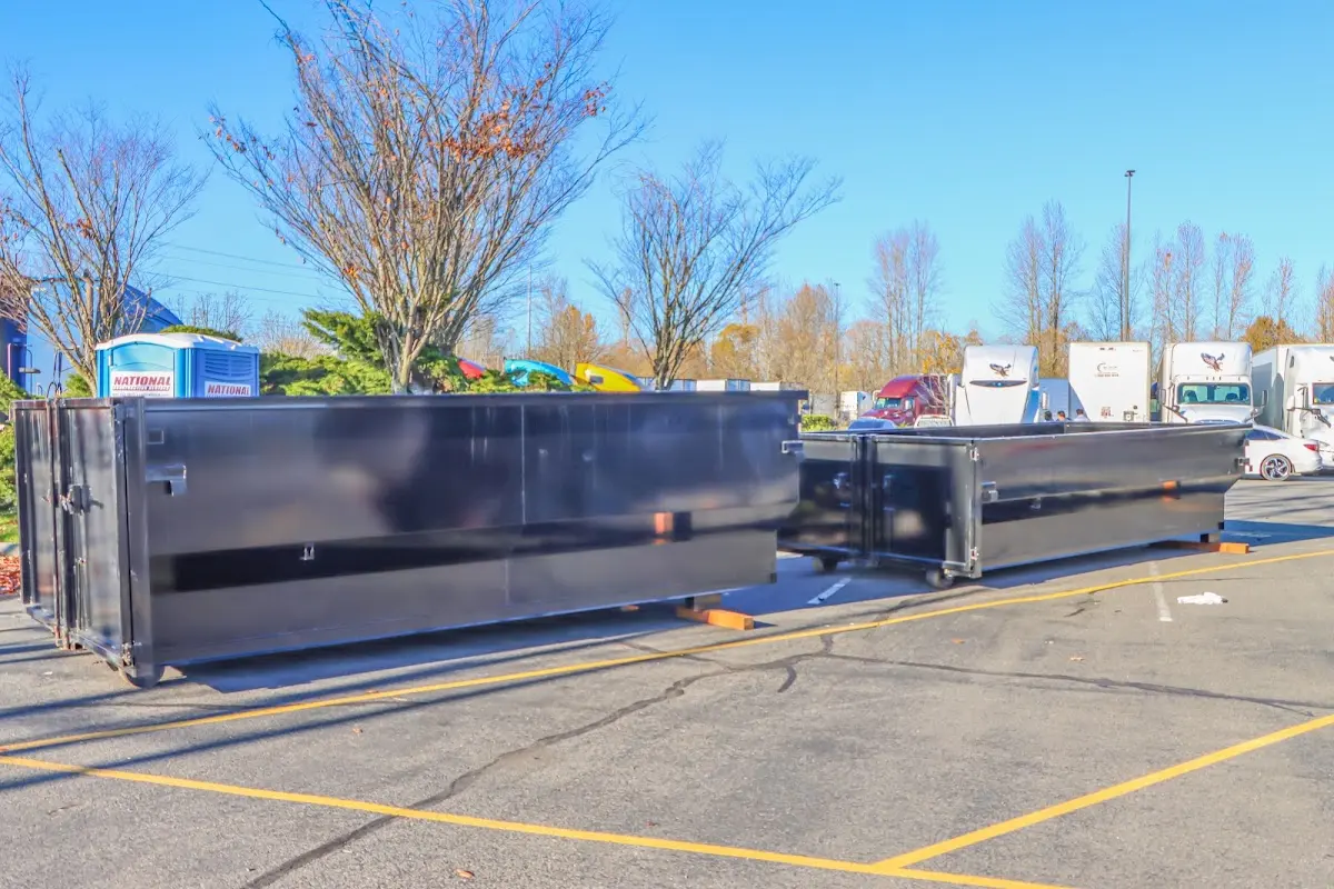 Professional dumpster rental service with roll-off container on residential driveway in Leacock